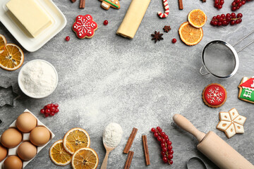 Fototapeta na wymiar Frame of Christmas cookies and flour on grey table, flat lay. Space for text