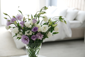 Beautiful bouquet with Eustoma flowers in bedroom