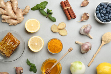 Flat lay composition with fresh products on grey table. Natural antibiotics