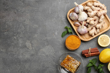 Flat lay composition with fresh products on grey table, space for text. Natural antibiotics