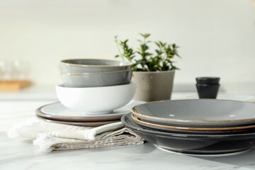 Fototapeta na wymiar Set of beautiful ceramic tableware on white table in kitchen