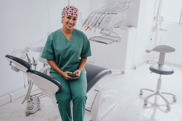 Young blond Caucasian female opening her mouth while African-American ethnic dentist in white latex gloves check condition of her teeth (focus on dentist)