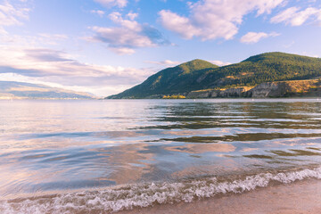 Summer evening view from sandy beach, of Okanagan Lake at Sun Oka Provincial Park