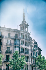 Naklejka premium BARCELONA - MAY 11, 2018: Buildings along Passeig de Gracia on a beautiful sunny day, aerial view