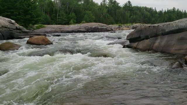White water rushing at Pabineau Falls, New Brunswick, Canada