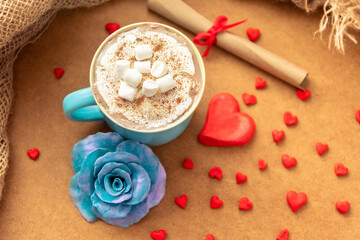 Blue cup with coffee and marshmallows for Valentine's Day.