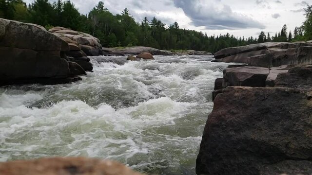 White water rushing at Pabineau Falls, New Brunswick, Canada - slow motion