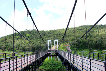 Fototapeta na wymiar Suspension bridge at Mae Kuang Udom Thara dam.