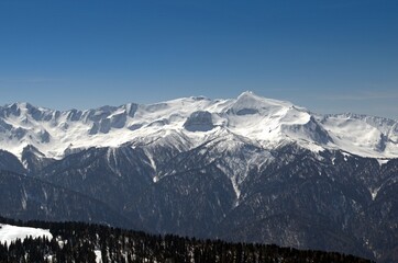 Winter landscape in the mountains with peaks and gorges, freestyle trails.