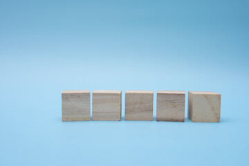 Wooden blocks on blue background