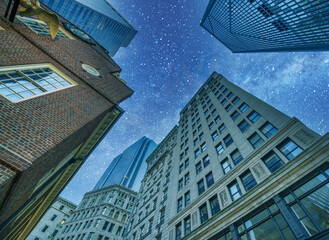 Fototapeta na wymiar Boston Skyscrapers under a starry night, upward view, Massachusetts