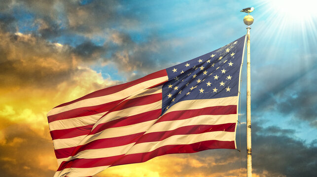 American flag waving against a beautiful sky