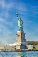 Fototapeta premium Sky colors on the background of Statue of Liberty, New York City
