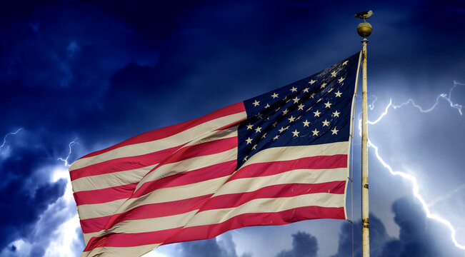 American flag under a coming storm