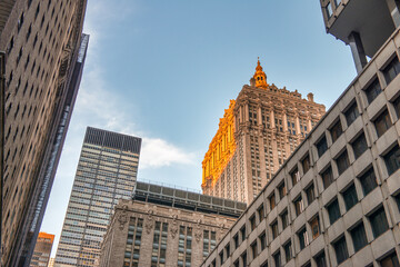 Fototapeta na wymiar Streets of Manhattan. New York City skyline from a lower viewpoint