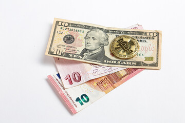 Turkish lira banknotes, US Dollars, Euro and bitcoin coin