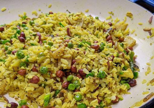 Kanda Batata Poha, a spicy, tangy Maharashtrian Breakfast made of fermented beaten rice.