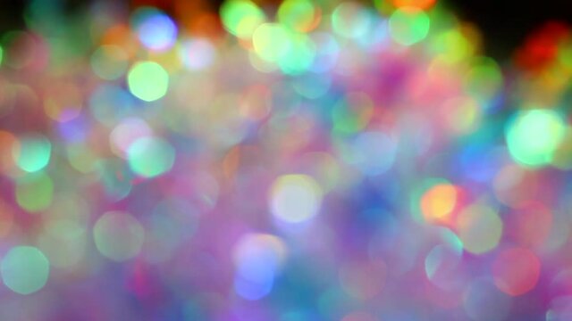 Blurred holographic holiday lights bokeh. Soft pastel neon pink blue purple silver colors circles. Luxury background for Christmas party. Posterized Abstract Effect