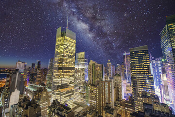 Aerial view of Manhattan Skyscrapers under a starry night, New York City - USA