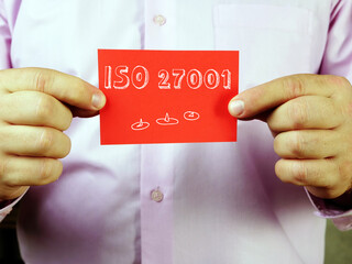 Business concept about  ISO 27001    with sign on the page.