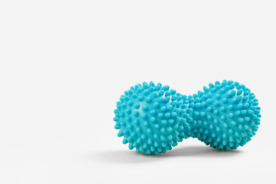 Blue double or peanut spikey ball massager for yoga pilates or stretching and fascia pain. Sports and massage