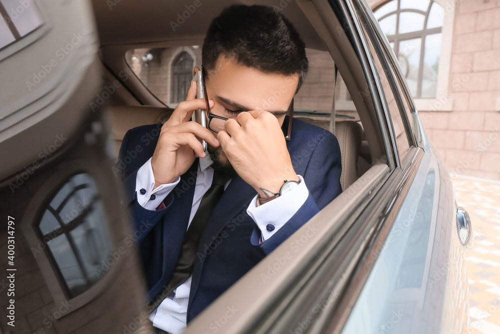 Canvas Prints Stressed businessman in modern car