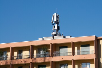 Telecommunication antenna of 4G and 5G network on a building in Sorengo, Switzerland
