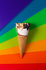 Ice-cream cone on a bright rainbow background