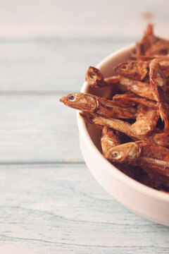 Dried Indian anchovies fish on bowl	
