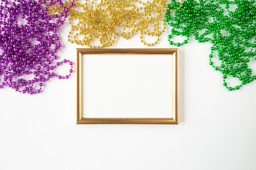 Mardi gras background, mockup on white with golden frame, beads and copy space