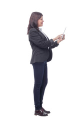 Full length portrait of attentive modern business woman with clipboard and pen