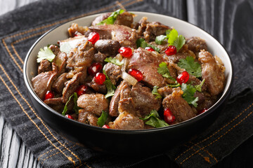Chicken heart, liver and gizzards are stewed with wine, onions and spices, and then served to the festive table, sprinkled with pomegranate seeds and cilantro