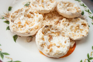 Chocolate souffle sweets or bird's milk on a white wooden table. Selective focus