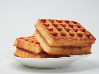 Traditional Belgian waffles isolated on white background, top view