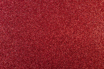 Texture of red sparkles, close up, bright colorful texture, close up