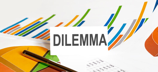 DILEMMA text on paper on chart background with pen