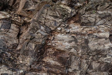 Cracked rocks, shale stone rock texture closeup