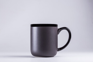 black  cup on grey background