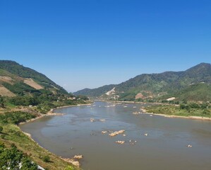 Naklejka na ściany i meble Mekong River separates Thailand and Laos