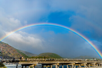Fototapeta na wymiar 【秋】嵐山に虹が架かる