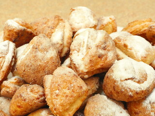 Fresh cottage cheese biscuits sprinkled with powdered sugar. Selective focus.