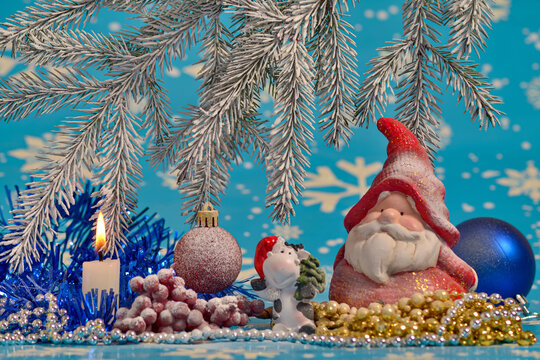 New Year and Christmas still life. Santa Claus, candle and decorations