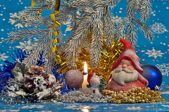 New Year's still life with Santa Claus, candle and decorations