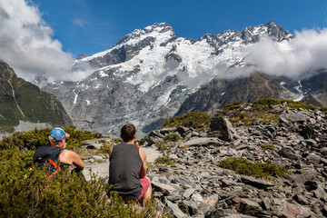 Fototapeta premium hikers taking a rest at mountains in the summer
