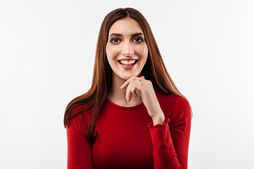 Image of young happy woman smiling and looking at camera, wearing in casual red clothes