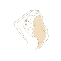 手櫛で髪を整える女性