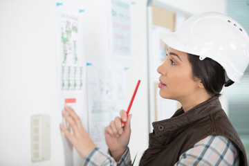 female designer in office working on architects project