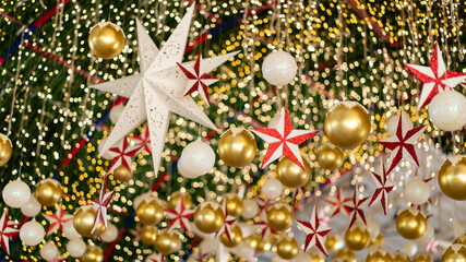 Facade New Year decoration. Closeup Christmas lights, stars and balls .