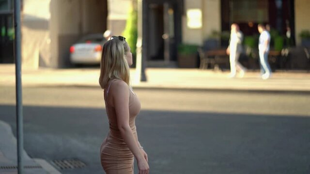 Beautiful girl on the background of the cityscape,  Slow motion