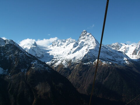 tourist lift with majestic mountains in the background